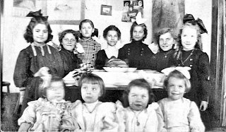 Grace Durst , far right with a dark bow in her hair.